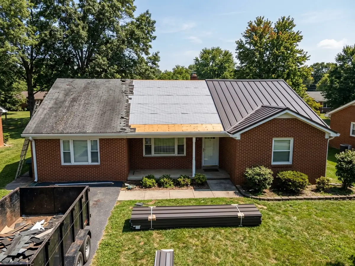 Brick ranch mid re-roof: old shingles, bare underlayment and new bronze standing seam panels